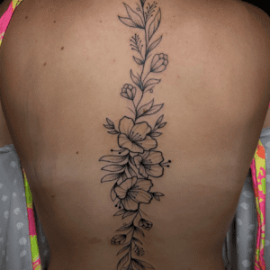 brooke dickens tattoo flowers down spine
